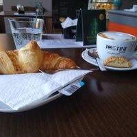 Cappuccino with croissant at Pestre in Bratislava