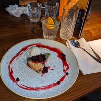 Warm vegan blueberry polenta cake with vegan vanilla ice cream  at The Castle in Wakefield