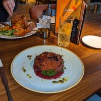 Candied root vegetables bake on a bed of seasonal greens, vegan  at The Castle in Wakefield