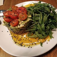 Avocado and quinoa tartare with cherry tomato, arugula (rúcula) and sweet reductions. at Hakuna Matata Veggie in Madrid