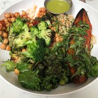Basic Bowl consisting of brown rice, sesame kale, chickpeas, gilled broccoli, grilled sweet potato, chiles, & magic green sauce.  Very good and freshly prepared. at Basic Kitchen in Charleston