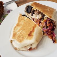 Warm toasted wrap with miso baked tofu, peanut butter,  sweet smokey mushrooms and slaw filling. A winning combo! 👍 at The Wildcat in Fort William