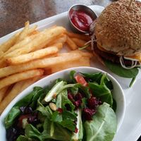 Monster burger with fries and salad at Ek's Grill in Kelowna