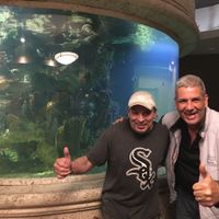 Chef Bill and my hubby Joe beside their beautiful 4500 Gallon aquarium  at Ek's Grill in Kelowna