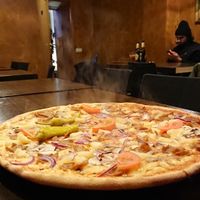 Kebabpizza with extra pineapple and mashrooms. Size is bigger, and the pizza looks more colourful in real, the photo don't make it justice. at Tellus Pizza in Hagersten