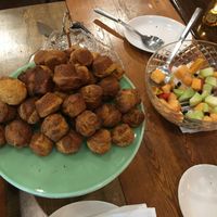 Brunch Buffet: lil cheeze muffins and fruit bowl. They also had some sweet lil blueberry muffins and coffee on this end of the buffet.  at Fig + Farro in Minneapolis