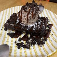 Brownie is hot, and gooey. Ice cream is perfect with it!   at Vegan Queen in Murcia