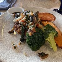 Lentil steak and “shrimp” with sweet potato’s. Delicious!   at Ike's Bistro in Oranjestad