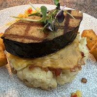 Soy fish on cauliflower gratin with fried polenta and corn salsa. Fish had amazing taste and texture   at Ike's Bistro in Oranjestad