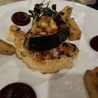 Vegan Soy Fish Filet with Cauliflower Steak and Polenta Fries  at Ike's Bistro in Oranjestad