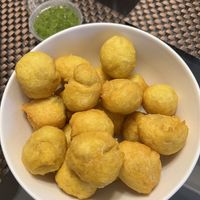 Dough balls with spicy chutney   at Sally's Roti Shop in Kingston