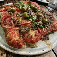 seitan with "cheese" and tomatoes at il Giardino di Devoto in Buenos Aires