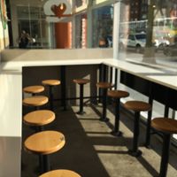 Stools to sit and eat (there are also tables and chairs nearby) at Next Level Burger - Brooklyn in Brooklyn