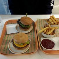 Sausage bacon and socal burgers, small oven baked fries and flavoured waters  at Next Level Burger - Brooklyn in Brooklyn