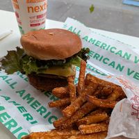 Chik'n Bacon Burger with Sweet Potato fries at Next Level Burger - Brooklyn in Brooklyn