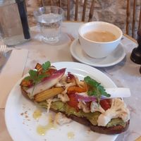 Vegan avocado toast with an oat milk latte at Saint Pearl in Paris