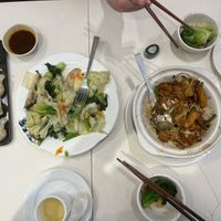 Partially eaten meal for two: dumplings, green vegetables, and rice noodle roll hotpot  at Sino Vegetarian Restaurant 大中華素食 in Kowloon