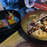 Left: funche (polenta base, black bean sauce); right: vegan gyoza at Marclee in Paris