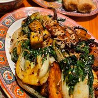 Sautéed vegetables with added tofu and spring rolls (nems chay) at Chez Tao in Quebec
