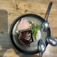 Chocolate lava cake with strawberry ice cream and coconut whipped creamm  at Bravocados in Tofino