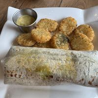 Brekky burrito, hashbrowns & side of hollandaise sauce   at Bravocados in Tofino