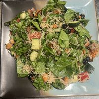 Spinach Salad with vegan noodles dressed with ginger and lime.   at Fresh From The Farm Juices in Canonsburg