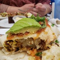 burrito: hashbrowns, tofu scramble, black beans, vegan chorizo, avo, salsa at Noble Restaurant in Wyoming