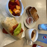 vegan burrito with fresh fruit, organic wheat toast & vegan chai latte with almond milk since they didn’t have oat milk.   at Noble Restaurant in Wyoming