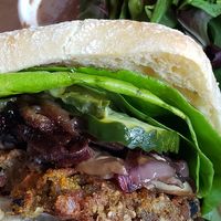 American burger w/ toppings of pickles, lettuce, mushrooms and grilled onions. at Hugo's Restaurant - Studio City in Studio City