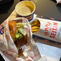 Temple deluxe “bacon & cheese” burger, fries, garlic sauce and cheese sauce at Temple of Seitan - Camden in North West London