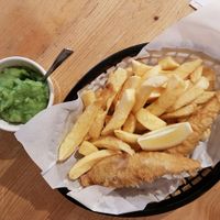 huge portion fish and chips and mushy peas at Sutton and Sons in North London