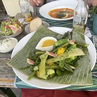 Asparagus, fennel, snow peas, peas, broccoli, pineapple, mango and watermelon radish steamed in banana leaf.  at Restaurant Rosa's in Sittard