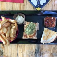 Vegan quesadillas, burrito and chips with mayo at Restaurant Rosa's in Sittard