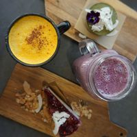 Turmeric coconut latte, blueberry muffin smoothis, berries cheesecake, matcha cheesecake at Eight - The Health Lounge in Lisbon