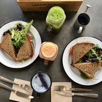 Forest and Tundra toasts, lite green juice, pink lemonade. Vanilla latte.  at Eight - The Health Lounge in Lisbon