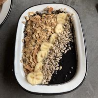 Black diamond smoothie bowl: coconut milk, banana, blueberry, activated charcoal at Eight - The Health Lounge in Lisbon