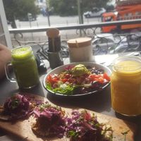 Plate of different tapas, really nice salatbowl with beans an quinoa, and fresh smoothies with great flavour! 
 at Eight - The Health Lounge in Lisbon