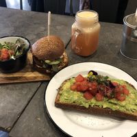 Temper burger, avocado toast and pink lemonade juice  at Eight - The Health Lounge in Lisbon