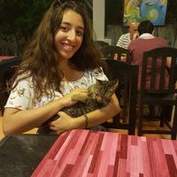 Playing with the furry resident at Bouganville Pizzeria in Ao Nang