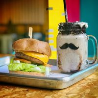 Vegan burger and half-emptied vegan shake at Regrub Burger Bar in Calgary