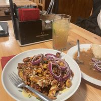 Poutine w/ jackfruit, lemon lemonade,  dark beer goulash  at Střecha in Prague