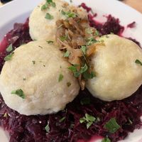 Dumplings w red cabbage stuffed with meat alternative  at Střecha in Prague