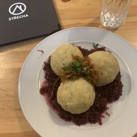 Dumplings on red cabbage, filled with soy  at Střecha in Prague