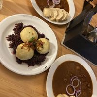 filled dumplings on red cabbage and goulash  at Střecha in Prague