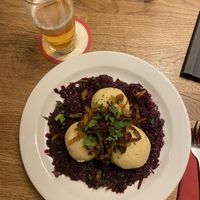 Dumplings filled with smoked soy on red cabbage   at Střecha in Prague