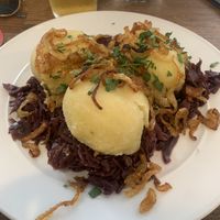 Smoked soy mince filled dumplings and delicious red cabbage 🥬   at Střecha in Prague