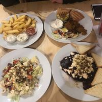 Grilled beetroot with vegan feta, salad, fries and kebab plate with hummus, pita and garlic dip at Střecha in Prague