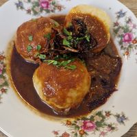 Dumplings with red cabbage and gravy at Střecha in Prague
