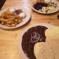 Dinner for two.. Goulash with dumplings, Seitan Kebab plate and chips with three dips at Střecha in Prague