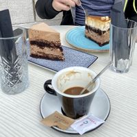 Snickers and chocolate cake + coffee with rice mylk at Cajnica Vanilla in Koper